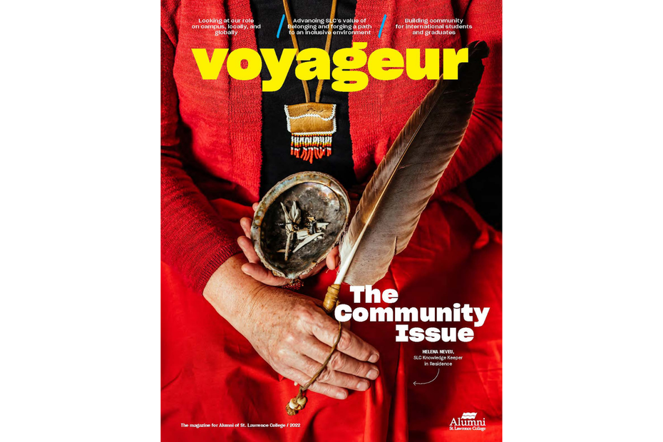 The cover of Voyageur, with a close up of Helena Neveu, Knowledge Keeper in Residence, who holds a feather
